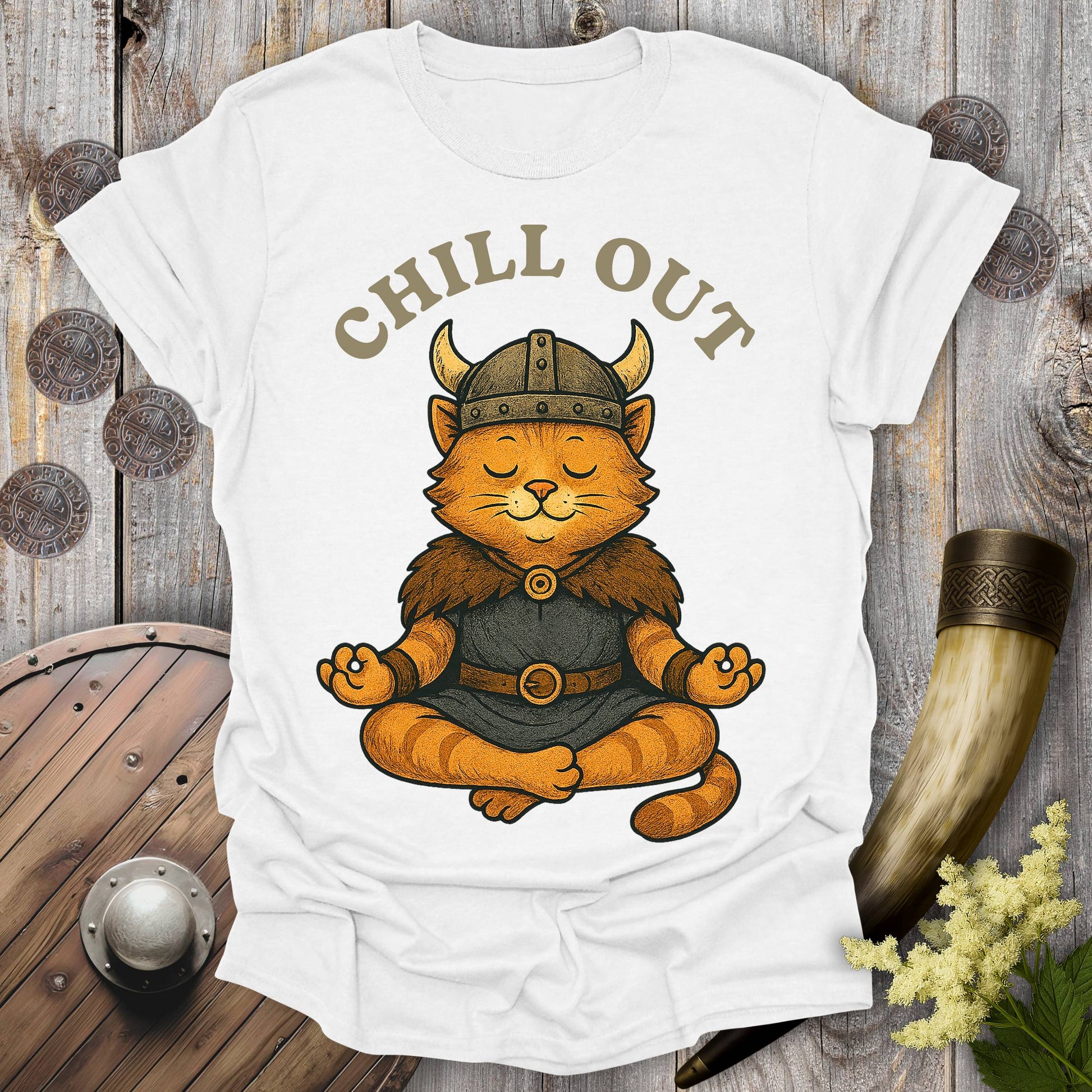 White t-shirt with a orange tabby cat wearing a Viking helmet meditating and 'Chill Out' text.