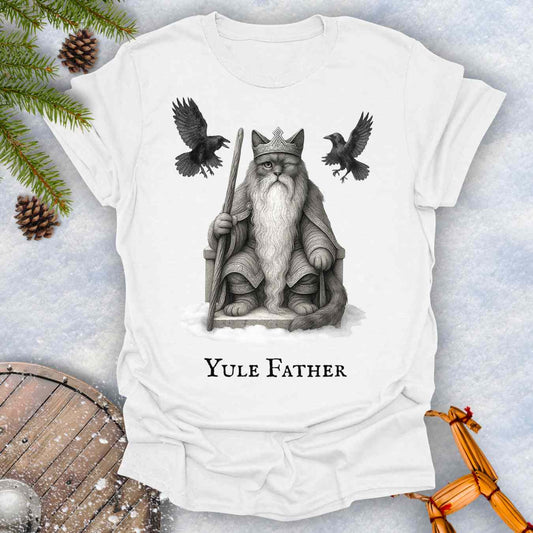 White T-Shirt with the aesir Odin reimagined as a black cat. Text 'Yule Father' design on a snowy background.