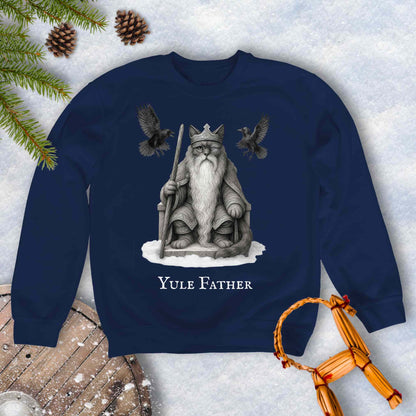 Navy blue sweatshirt with the aesir Odin reimagined as a black cat. Text 'Yule Father' design on a snowy background.